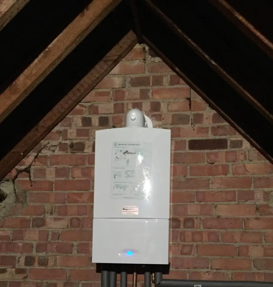 Gas Safe engineer installing a Worcester Bosch boiler in Farnham
